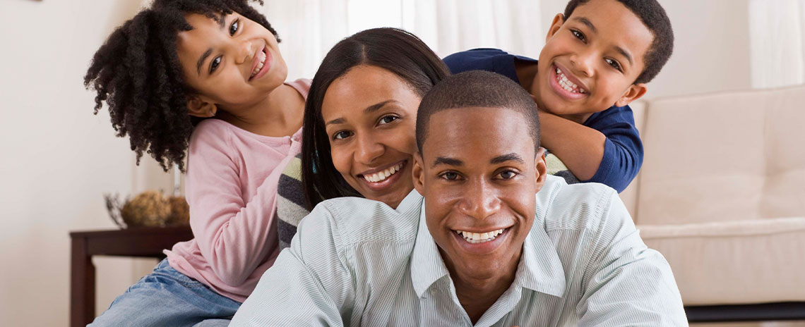 Family smilling after dental care in Livermore