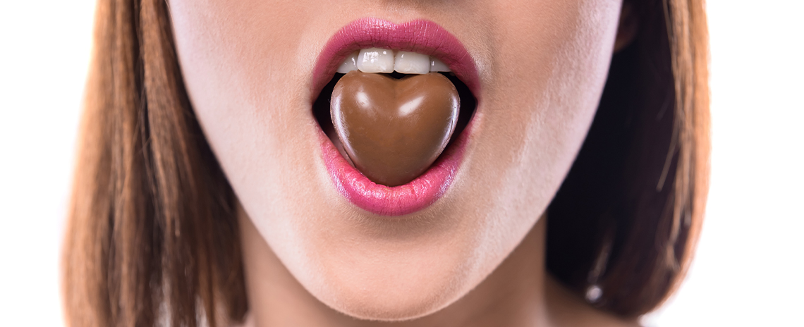 Women eating chocolate Foothill Dental Care in Livermore