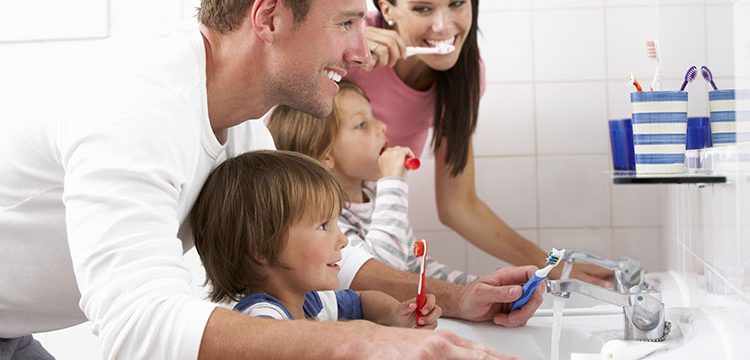 Family Brushing Teeth Together | Livermore Dentists